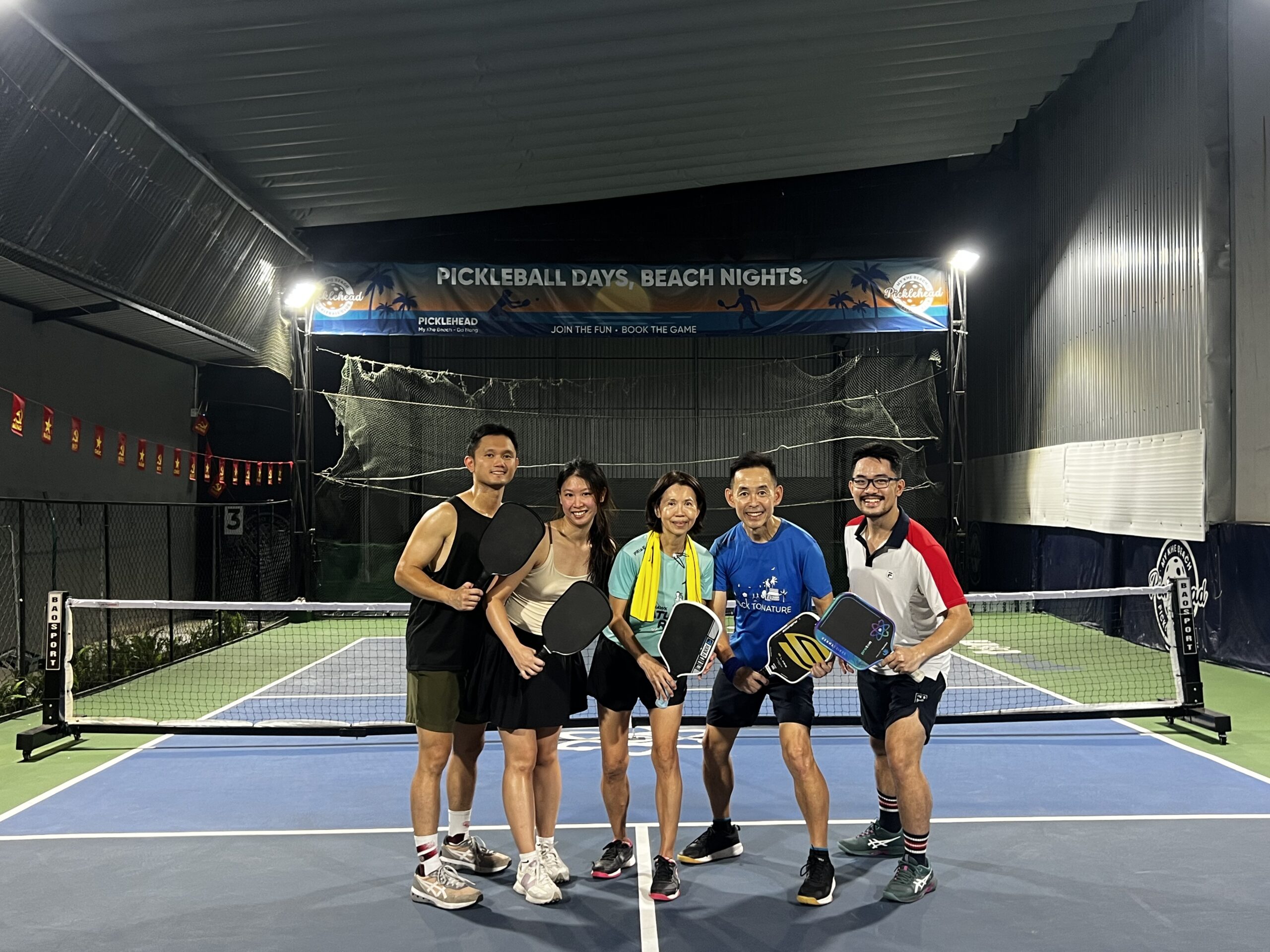 Coach-Ho-guided-a-group-pickleball-drill-and-play-for-students-from-Singapore.